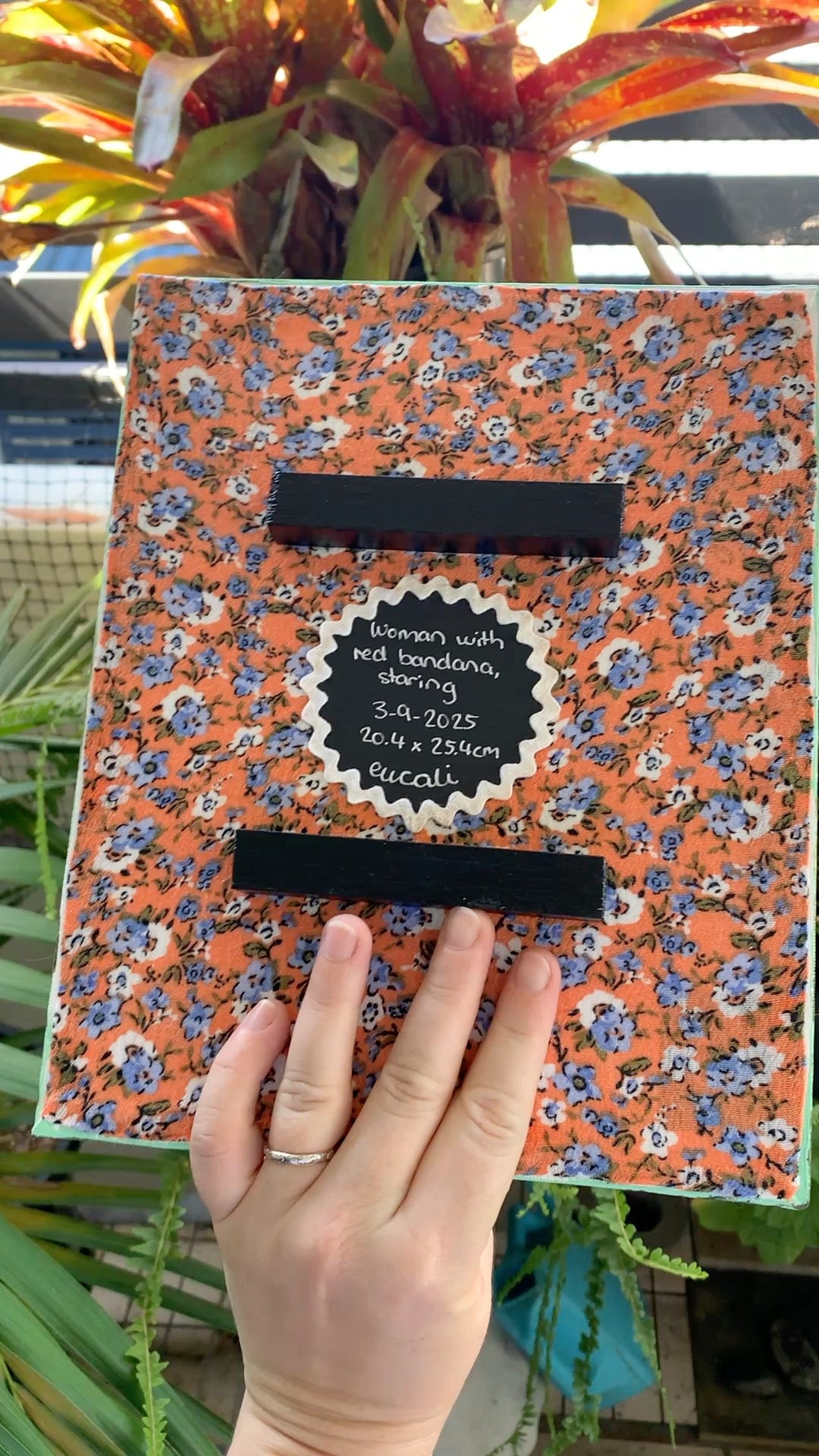 Woman with red bandana, staring, 2025