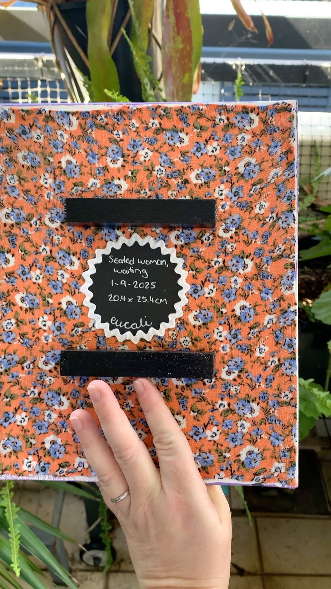 Seated woman, waiting, 2025